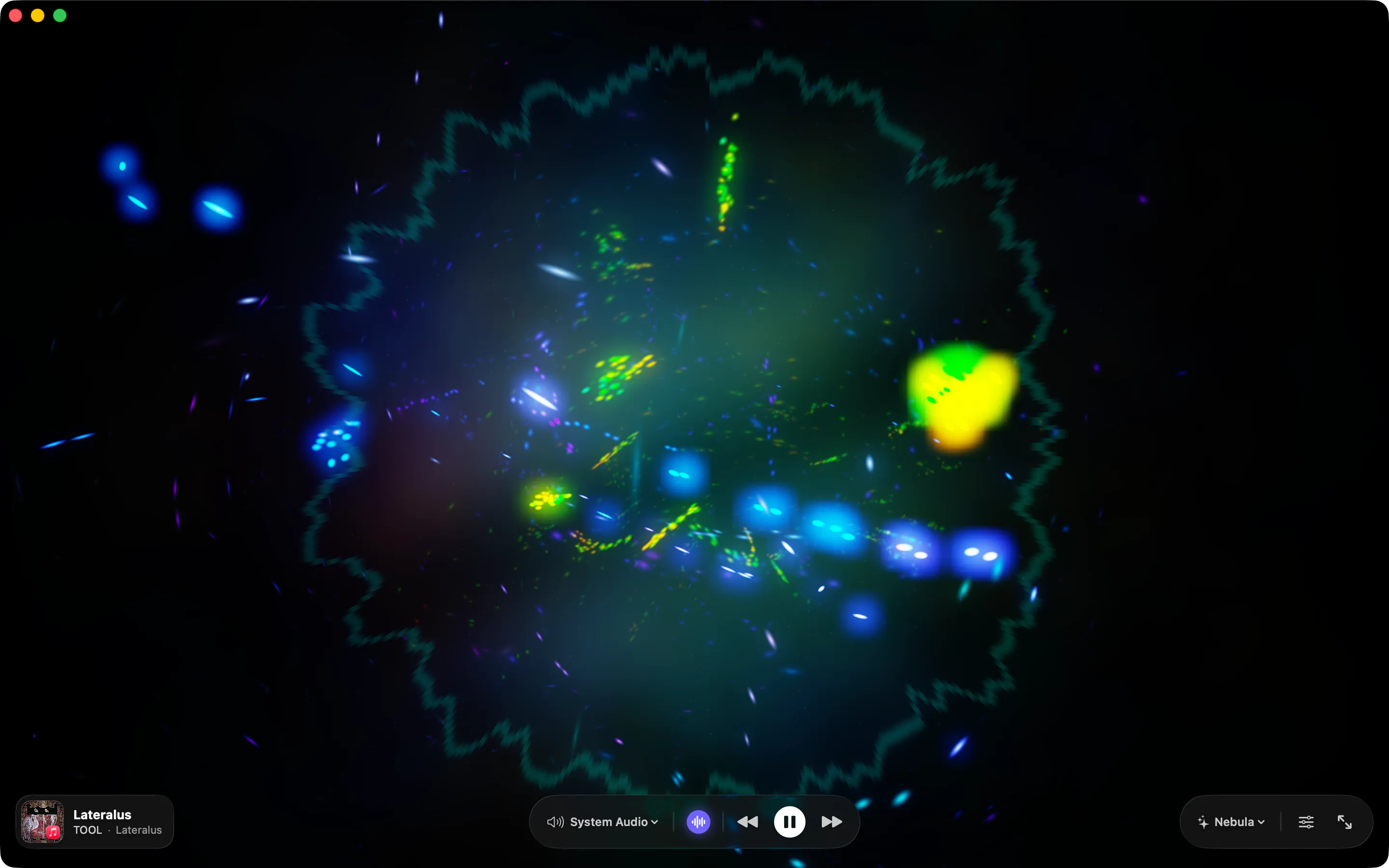 Synesthia in a window on macOS running Nebula: a cloud of blue, green and gold particles hanging on black inside a faint ring, with the now-playing badge and playback controls along the bottom.
